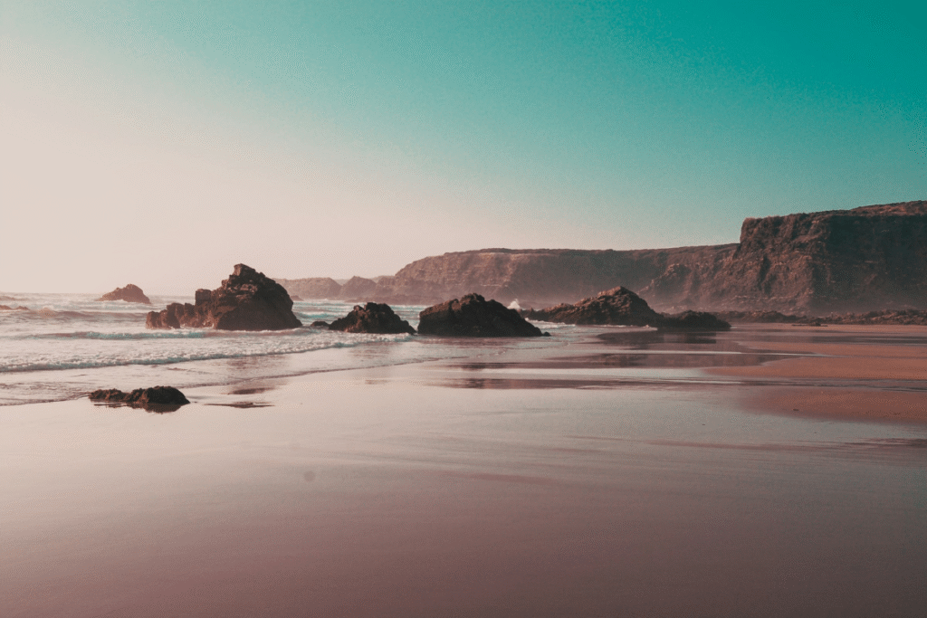 Praia de Nossa Senhora do Mar, a vast sandy beach near Zambujeira do Mar on Portugal’s Vicentina Coast, highlighting coastal travel scenery