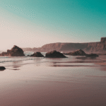 Praia de Nossa Senhora do Mar, a vast sandy beach near Zambujeira do Mar on Portugal’s Vicentina Coast, highlighting coastal travel scenery