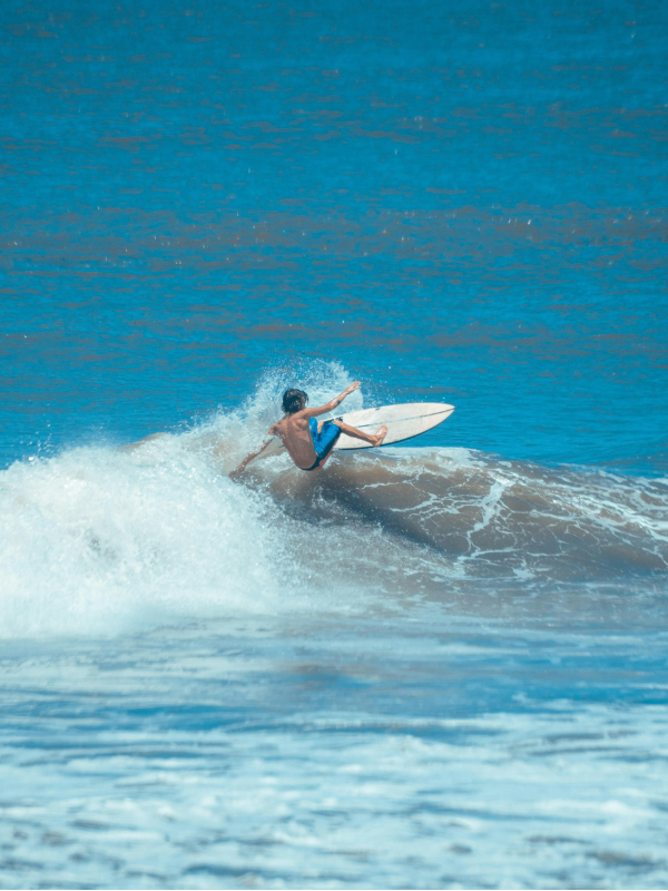 A Man Surfing on the Waves | Surf Culture