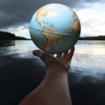 Person holding a clear glass ball symbolising water and sustainability for World Water Day 2026