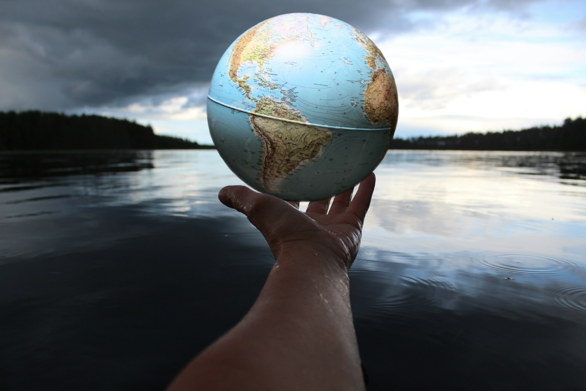 Person holding a clear glass ball symbolising water and sustainability for World Water Day 2026