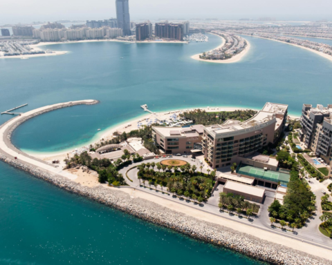 Aerial view of Palm Jumeirah’s artificial beaches and luxury waterfront developments along the Dubai coastline.