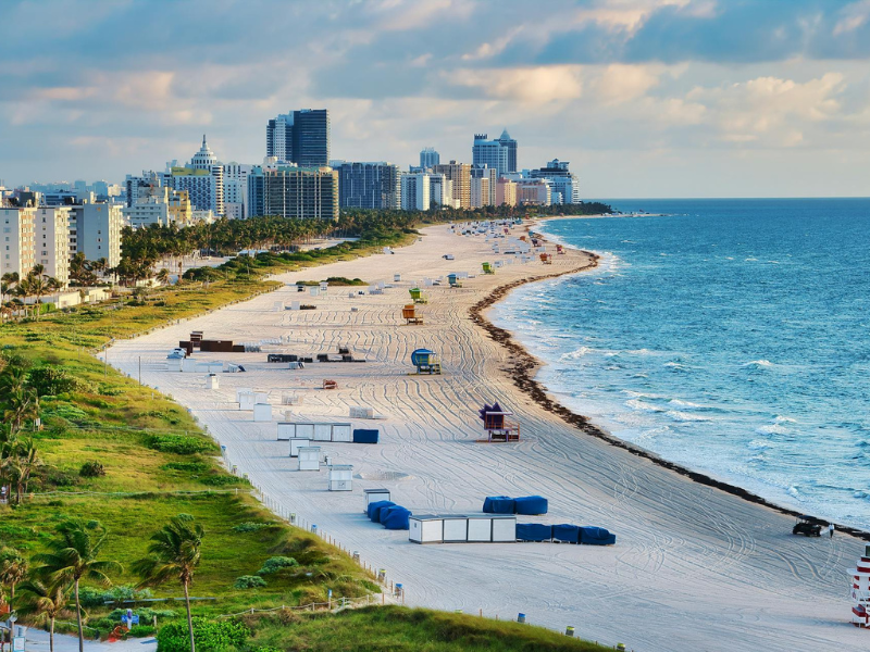 Raised roads, coastal infrastructure, and beachfront skyline in Miami Beach as part of the city’s “Rising Above” climate adaptation project focused on flood resilience, stormwater management, and coastal protection.