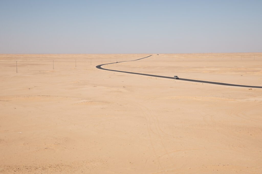 Road crossing the arid desert landscape surrounding the Sahrawi refugee camps.