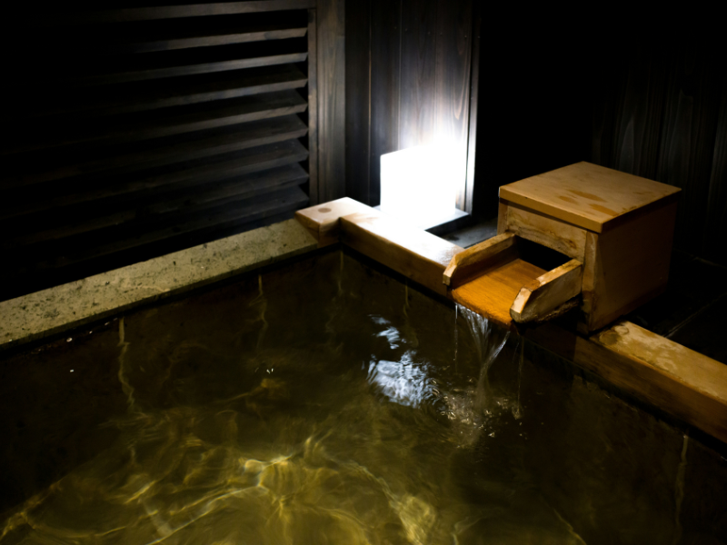 A tranquil Japanese bath, reflecting the enduring tradition of public bathhouses and communal bathing culture.