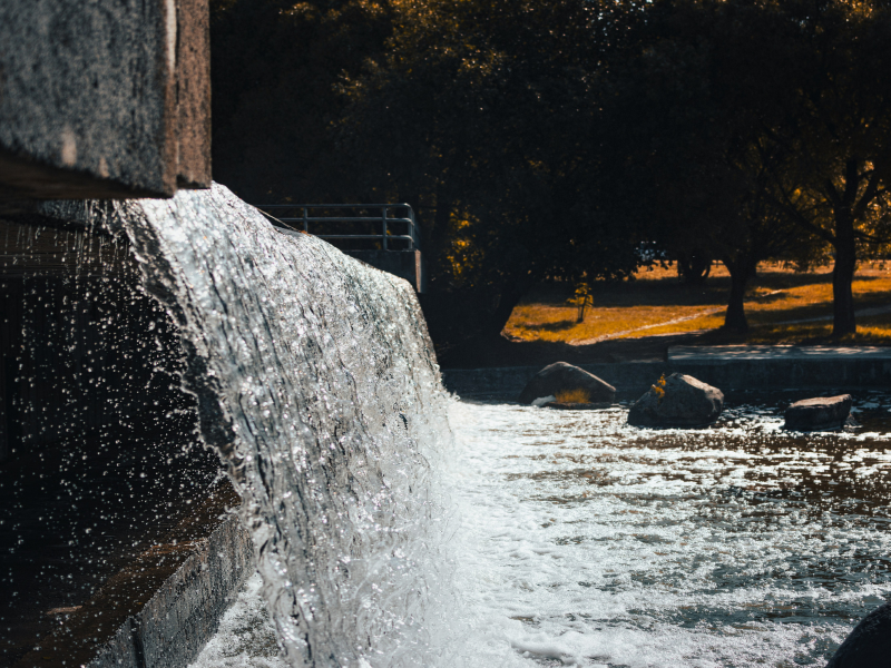 Flowing water over a man-made barrier adds another layer to river sound, showing how built structures can reshape a freshwater soundscape.