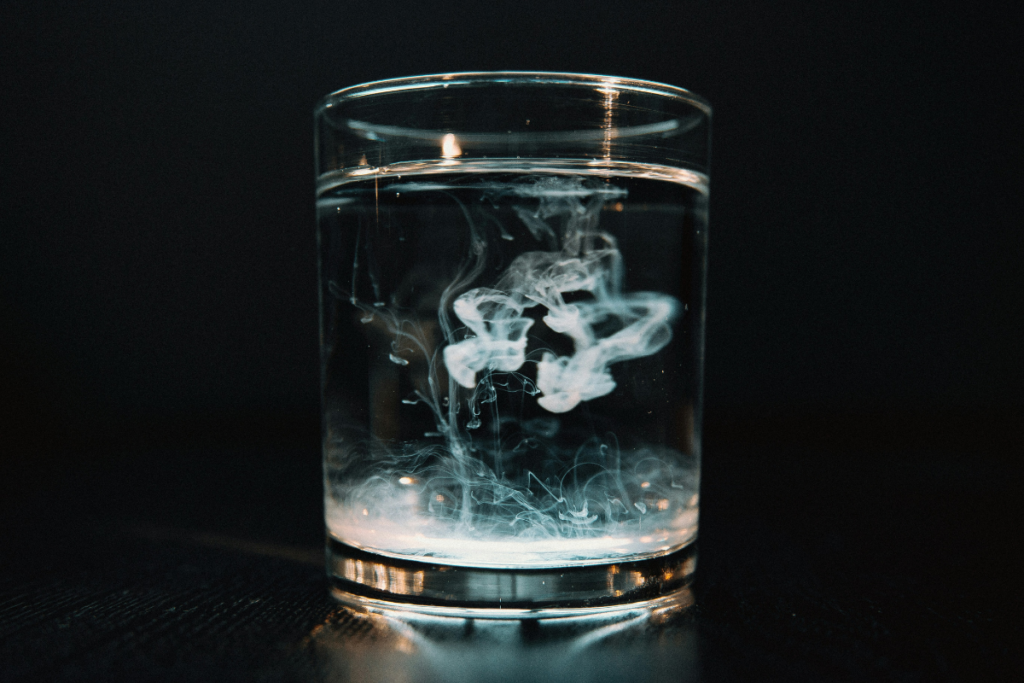 Glass of water illustrating the presence of persistent chemicals such as PFAS in drinking water.
