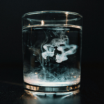 Glass of water illustrating the presence of persistent chemicals such as PFAS in drinking water.