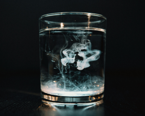 Glass of water illustrating the presence of persistent chemicals such as PFAS in drinking water.